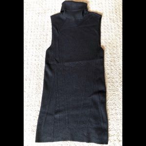 Sleeveless black turtleneck sweater